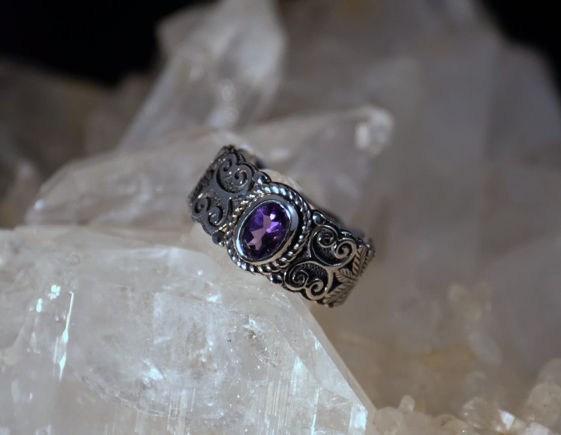 Ornate scroll silver ring with tanzanite on crystal